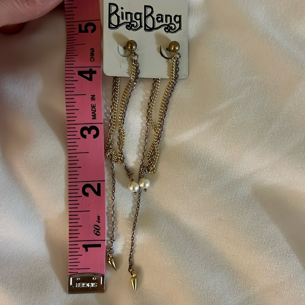 Mixed metal dangling long chain earrings with pearl and cone detail